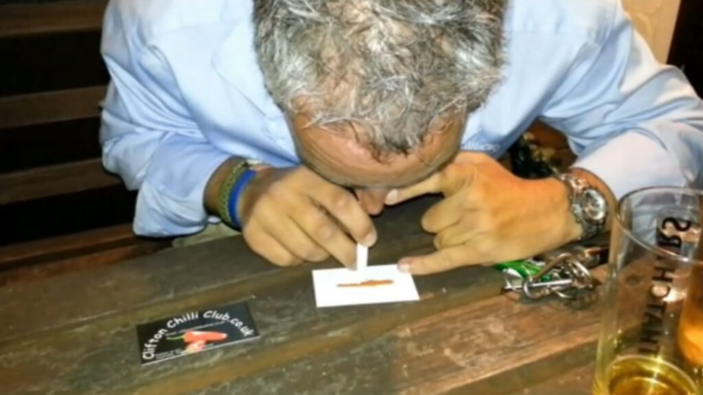 Chilli Dave snorting Chilli Powder